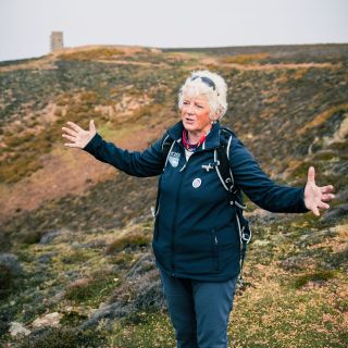 Nicky Mansell a Jersey Uncovered Guide leading a group on Grosnez headland