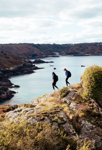 Two friends walking on the cliff paths of Jersey