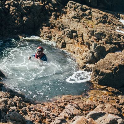 group coasteering in rock pools