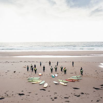 A group of surfers prepare to go in the water