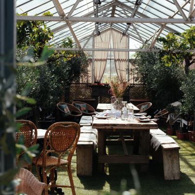 Decorated greenhouse with tables and chairs