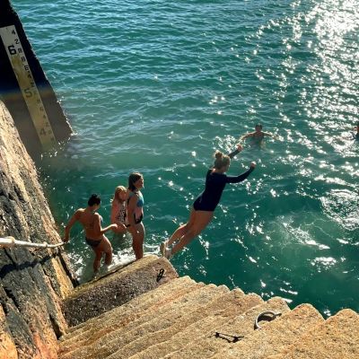 Swimmers on pier steps at Bouley Bay