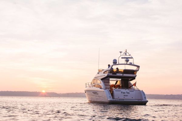 Fizz Too yacht at sea in the sunset. St. Aubin