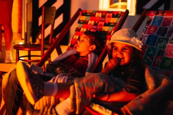 kids eating marshmallows by a fire