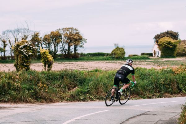 person cycling around a bend