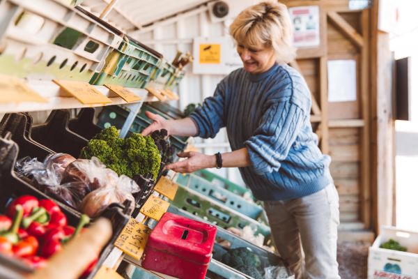 Christine Helio working at her farm stall