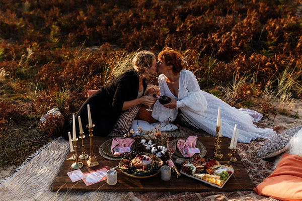 A couple having a romantic picnic for their wedding