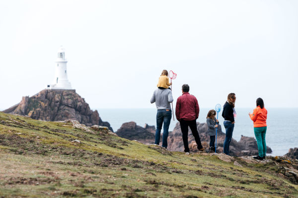 Family overlooking Corbiere Lighthouse