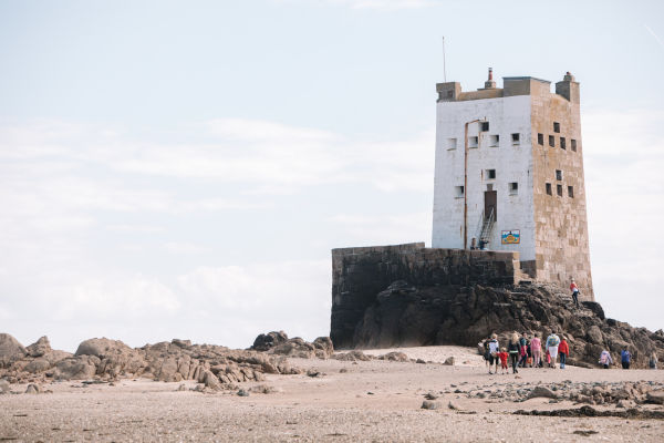 Family walking at low tide, Seymour Tower Jersey