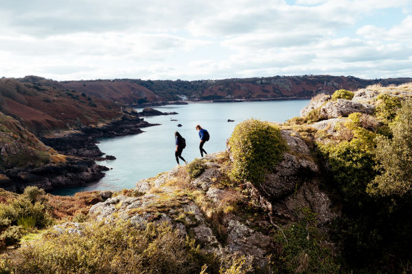 Two friends walking on the cliff paths of Jersey