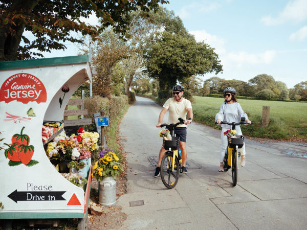 Two cyclists stopped at a Genuine Jersey road side food stall