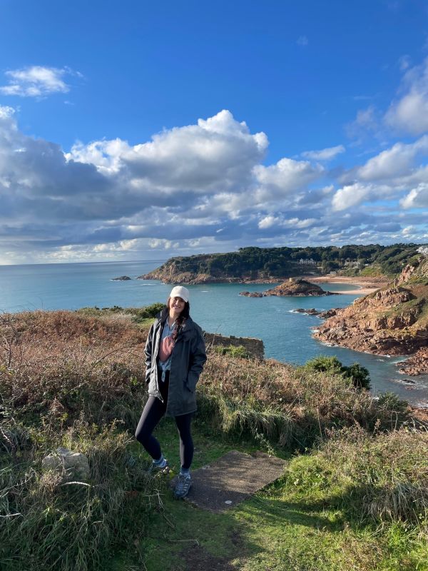 Women walking along coastline
