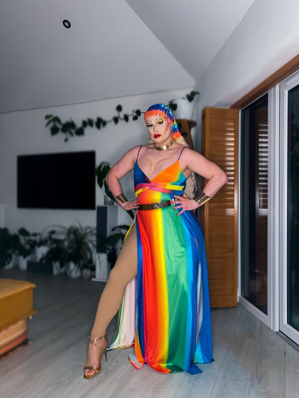 Drag queen dressed in pride colours
