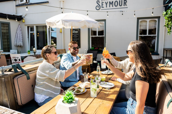 Group of friends having a meal at the Seymour Inn in Jersey