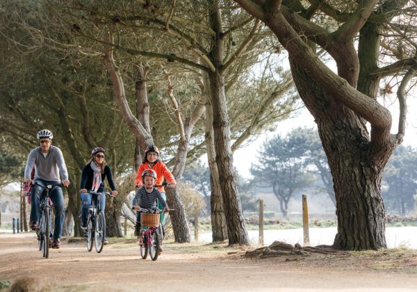 Family cycling up Corbiere cycle track