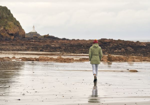 single person walking on the beach