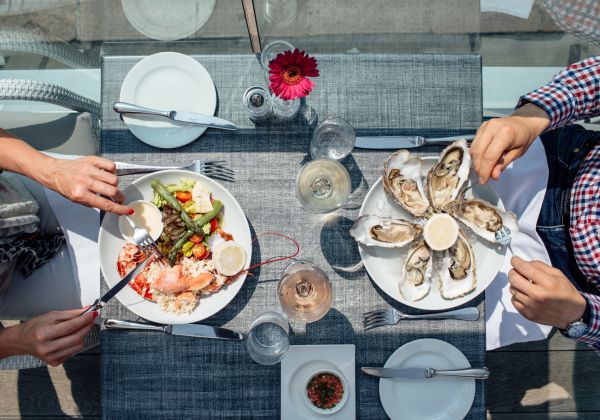 An aerial shot of a couple eating seafood at Sumas