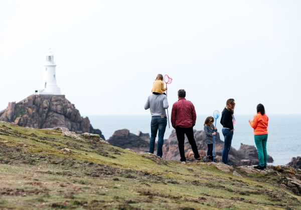 Family overlooking Corbiere Lighthouse