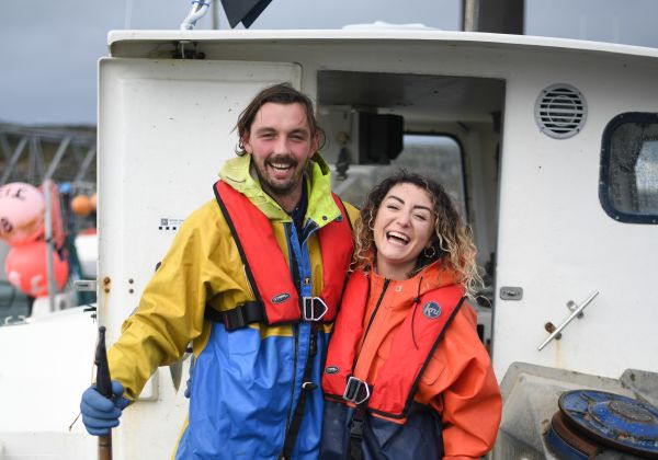 Couple on boat smiling