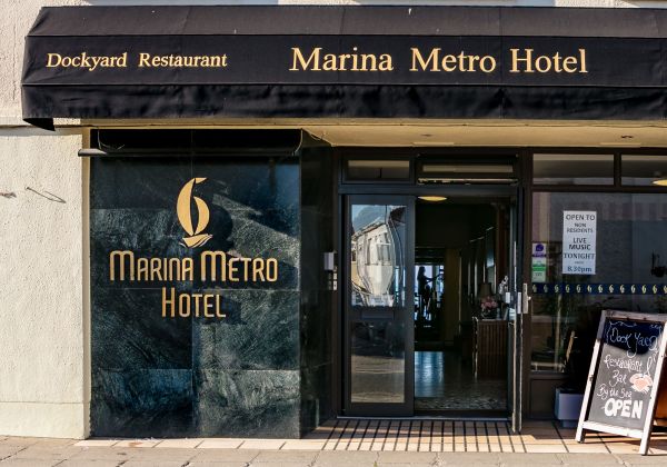 A picture of the front doors to the Marina Metro Hotel.