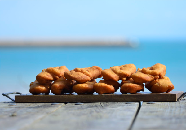 A tray of Jersey Wonders pictured in front of the sea at St. Catherine