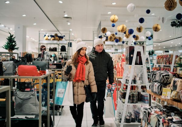 Couple shopping in a department store winter