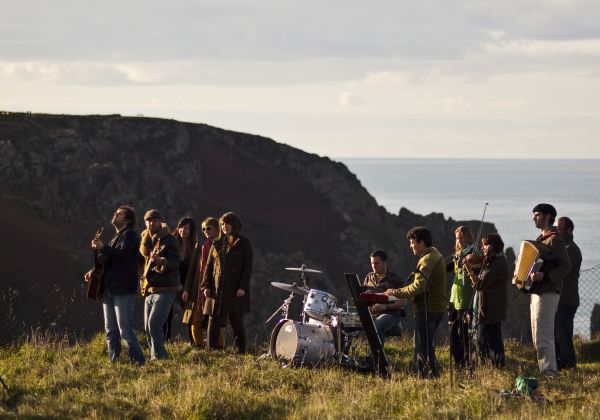 A picture of Badlabecques playing music on the cliffs on Jersey