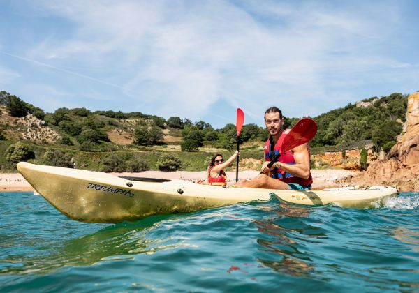 Person kayaking in the sea