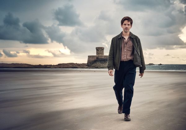 Bergerac actor Damien Molony walking along St. Ouen