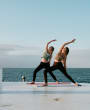 Two women do yoga at Harve de Pas Jersey