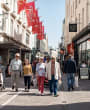A group of people shopping in St. Helier outside Voisin